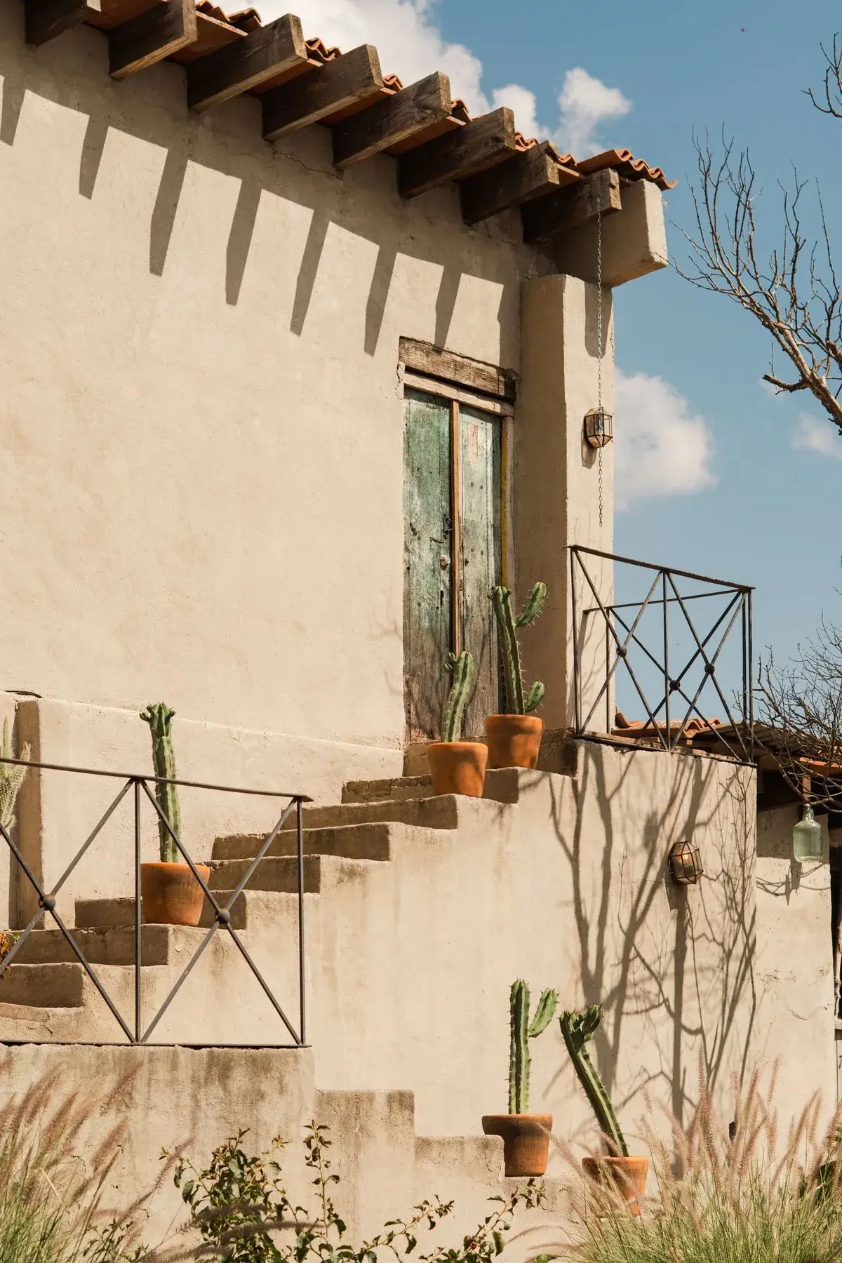 Desert stucco home with saguaro cactus in Tucson AZ